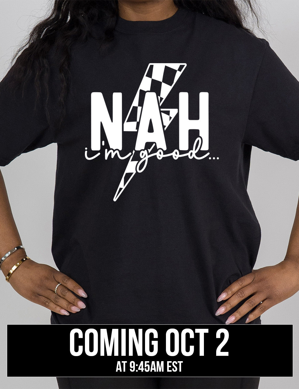 black modern tee with the large word "NAH" and small lowercase cursive words underneath saying "i'm good", and the graphic of a checkered lightning bolt behind the words, coming October 2nd