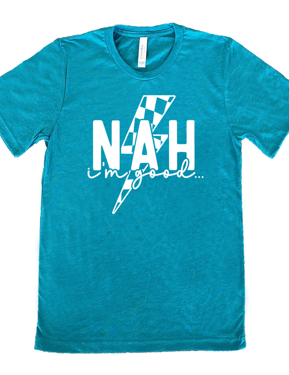 teal unisex tee with the large word "NAH" and small lowercase cursive words underneath saying "i'm good", and the graphic of a checkered lightning bolt behind the words