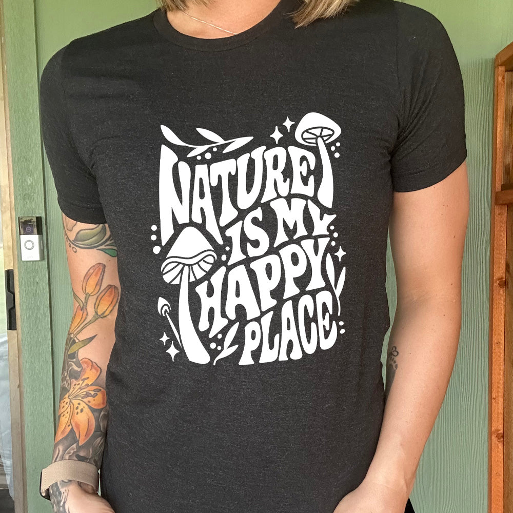 Black colored shirt with a wild mushroom graphic on it that says "Nature Is My Happy Place"