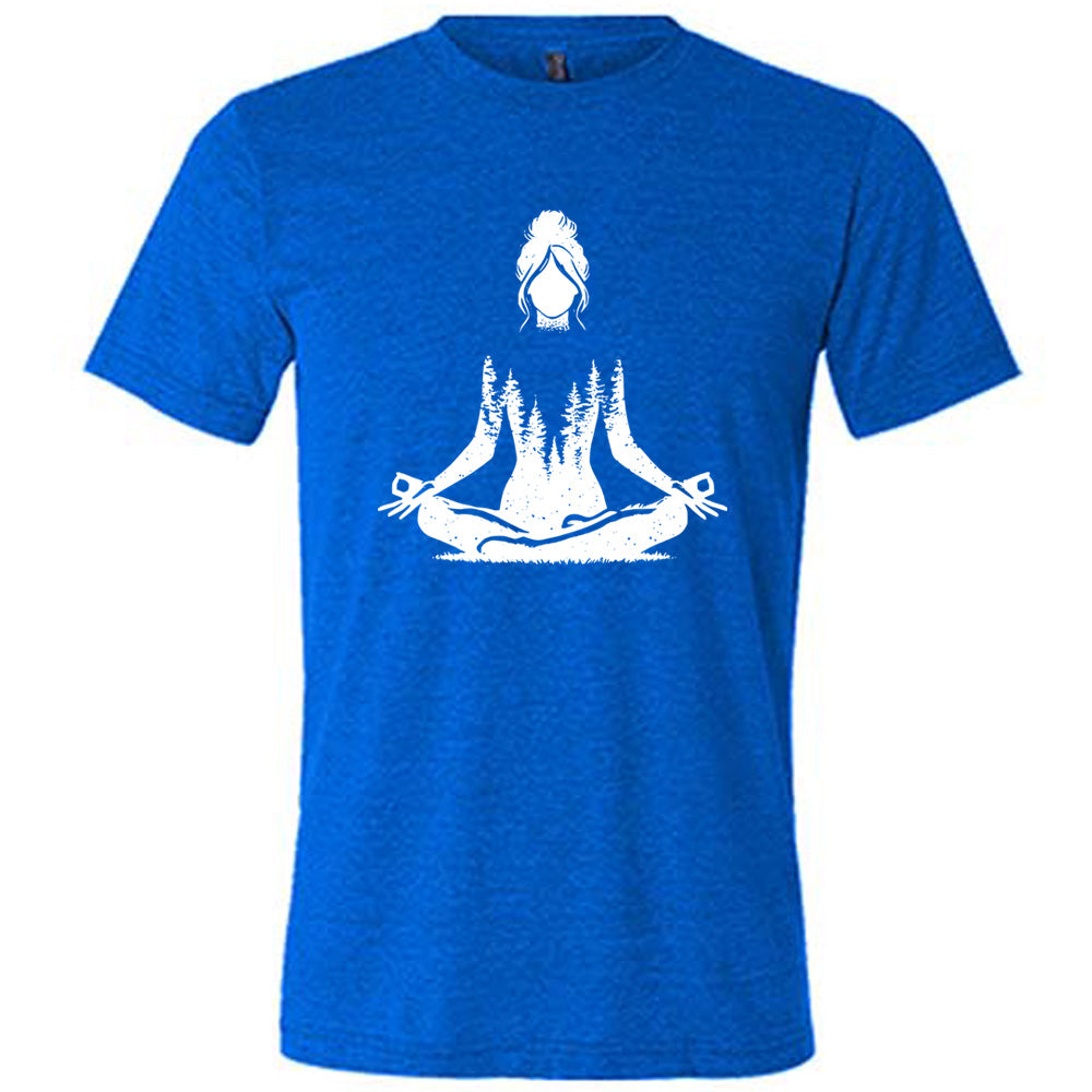 Blue unisex tee with the graphic of a woman doing a yoga pose, with her shoulders to waist being the silhouette of a forest  