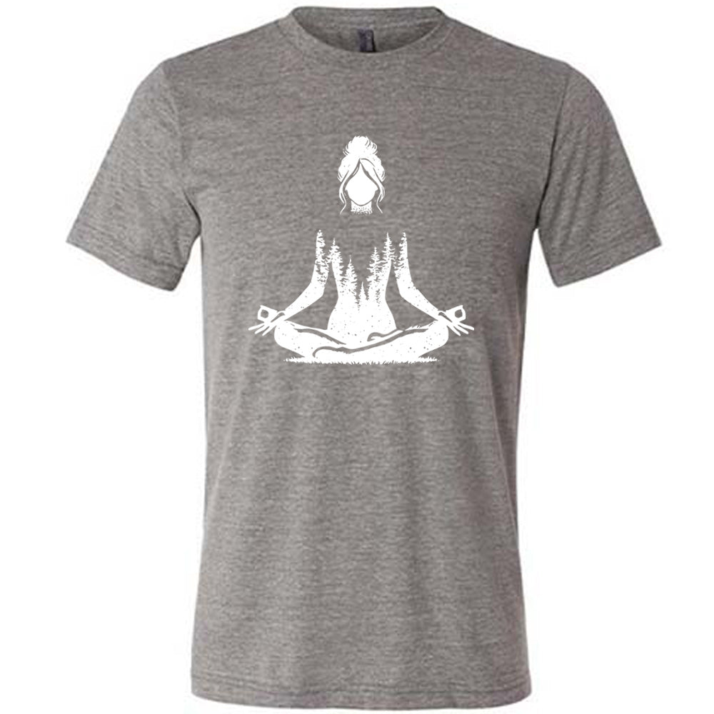 Grey unisex tee with the graphic of a woman doing a yoga pose, with her shoulders to waist being the silhouette of a forest  
