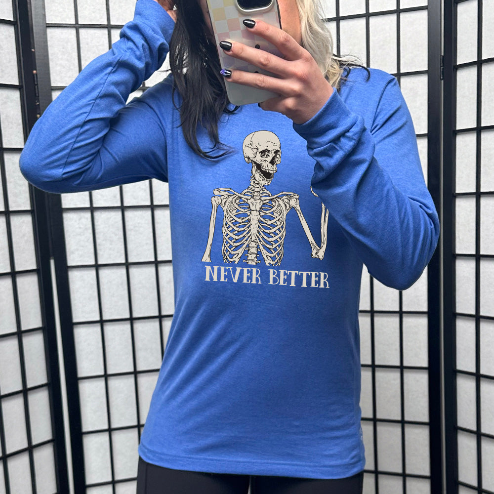 heather true royal long sleeve shirt with the text "Never Better" and a skeleton graphic on it
