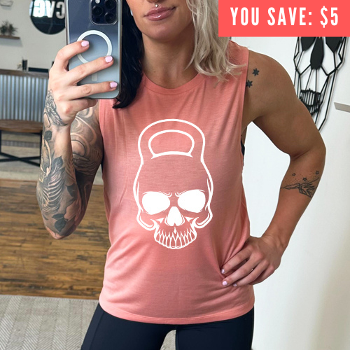peach muscle tank with a kettlebell skull graphic on the front