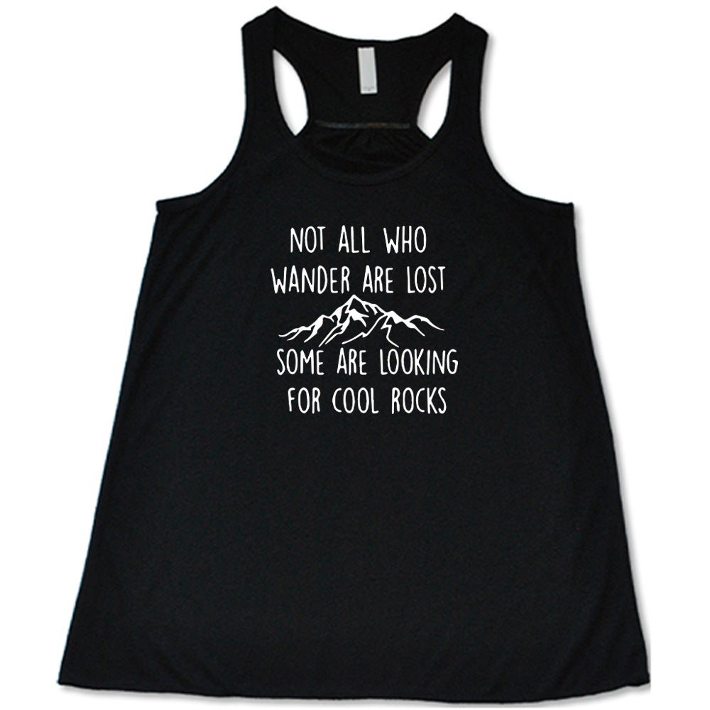 Black colored flowy tank with a mountain graphic on it that says "Not All Who Wander Are Lost Some Are Looking For Cool Rocks" 