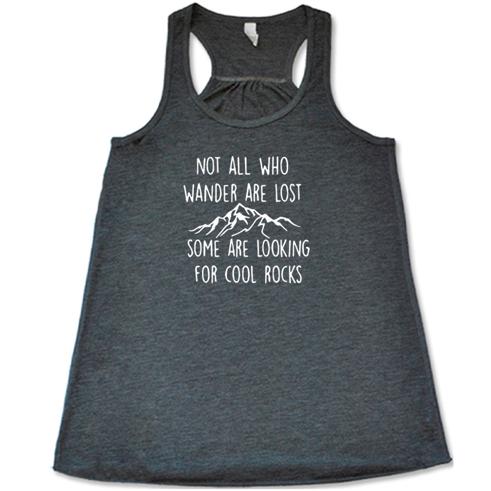 Grey colored flowy tank with a mountain graphic on it that says "Not All Who Wander Are Lost Some Are Looking For Cool Rocks" 