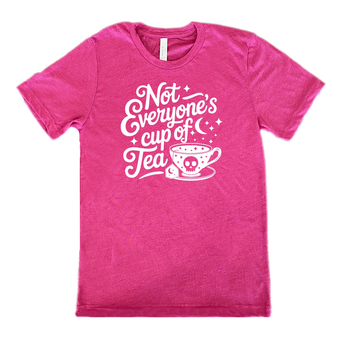 berry unisex tee with the words "not everyone's cup of a tea" in a cursive font, with the graphics of a moon and little stars, and a tea cup with a skull on it with stars and the tea bag has a moon on it