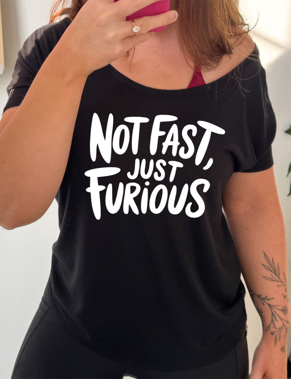 black slouchy tee with the words "not fast, just furious" on it