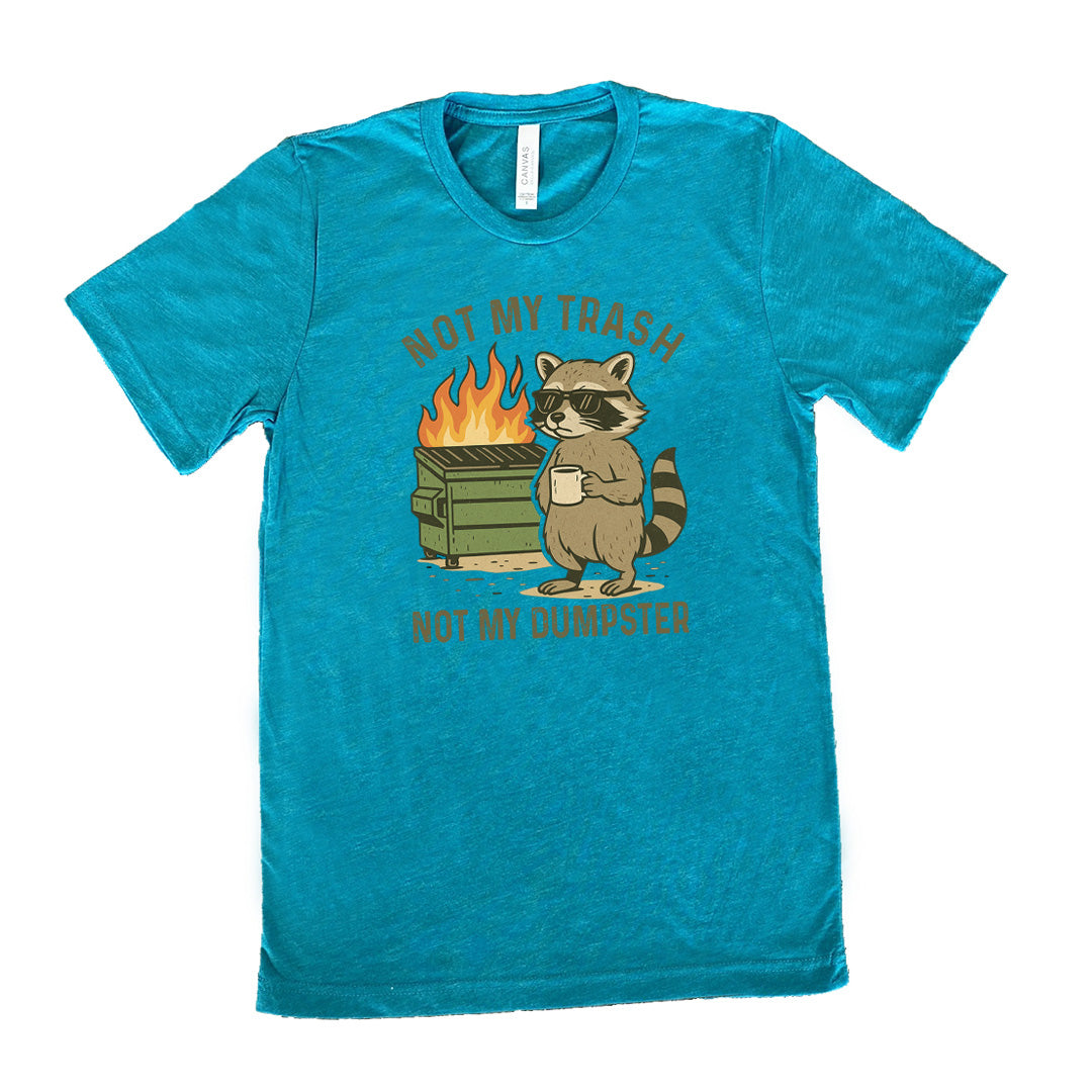 Teal Unisex Tee, with wording Not My Trash Not My Dumpster, image of racoon with sunglasses and coffee as well as a dumpster that is on fire