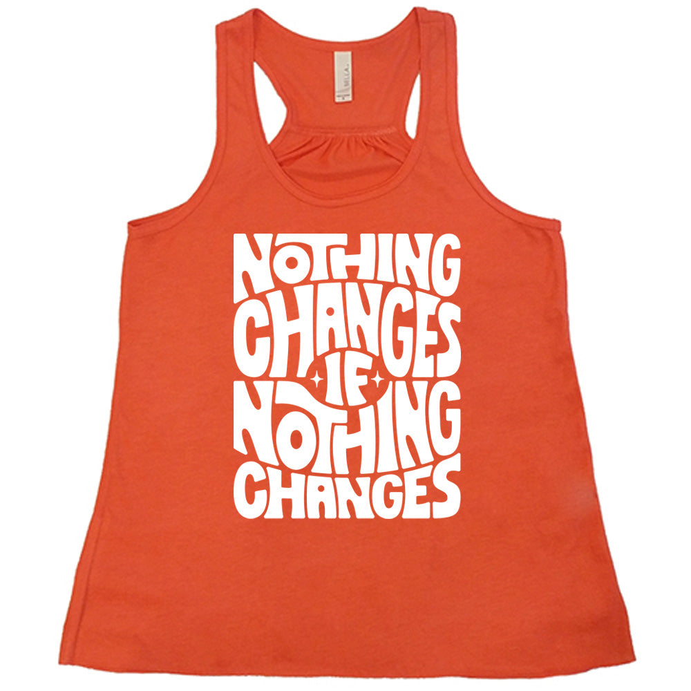 coral racerback flowy tank with the words "nothing changes if nothing changes" on it, with two tiny stars on either side of the word "if"