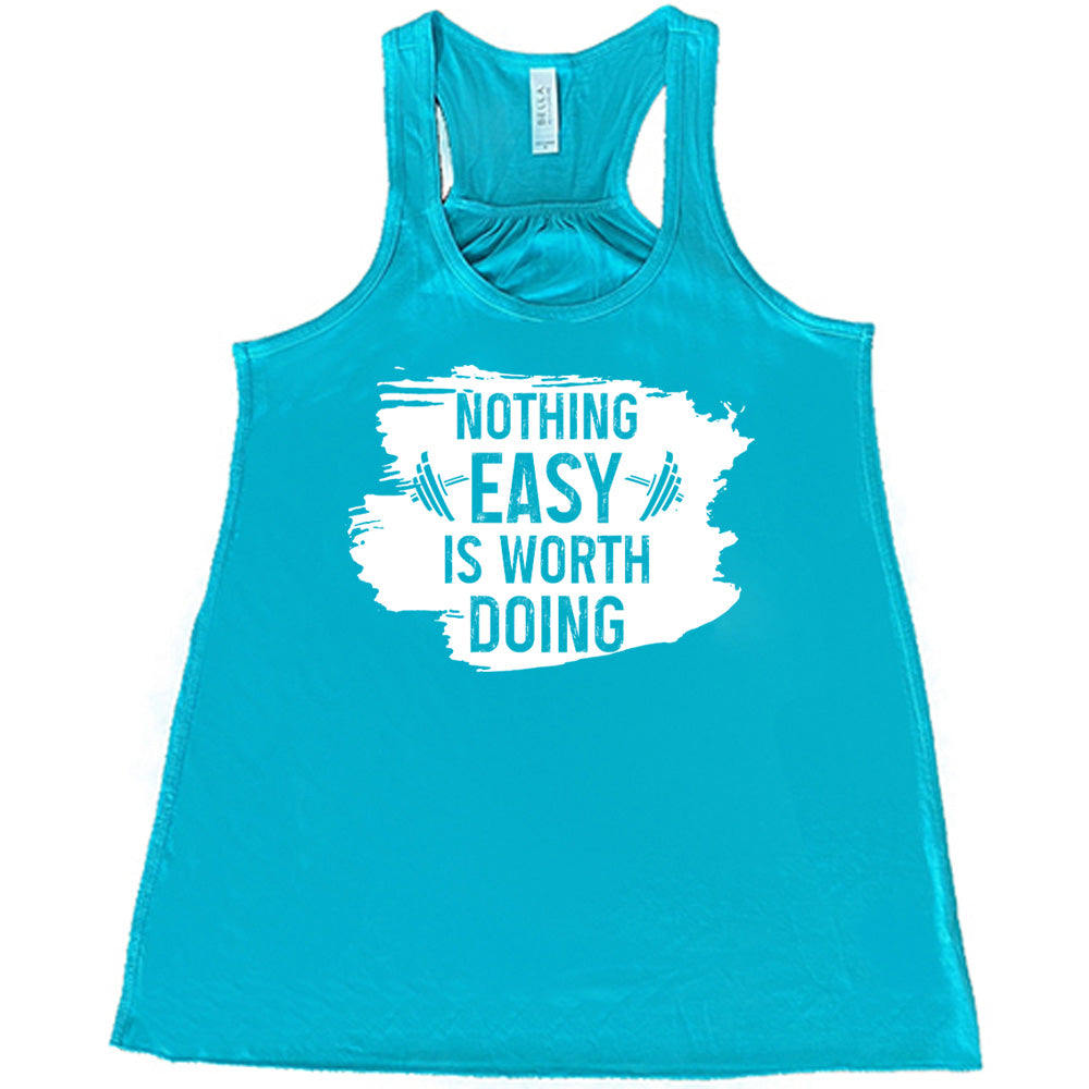 Teal Flowy Tank, with wording Nothing Easy is Worth Doing, lettering is color of shirt with barbells all over a white patch