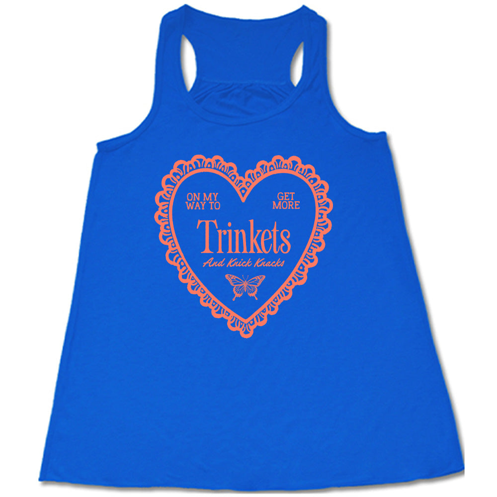 blue flowy tank with the graphic of a large heart with a lacy border, and within it the words "on my way to get more trinkets and Knick Knacks" and the graphic of a little butterfly