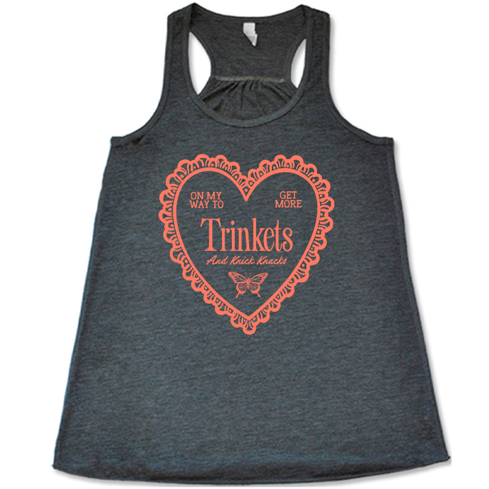 grey flowy tank with the graphic of a large heart with a lacy border, and within it the words "on my way to get more trinkets and Knick Knacks" and the graphic of a little butterfly