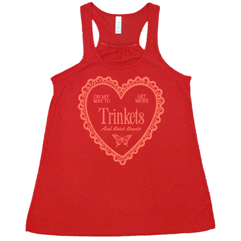 red flowy tank with the graphic of a large heart with a lacy border, and within it the words "on my way to get more trinkets and Knick Knacks" and the graphic of a little butterfly