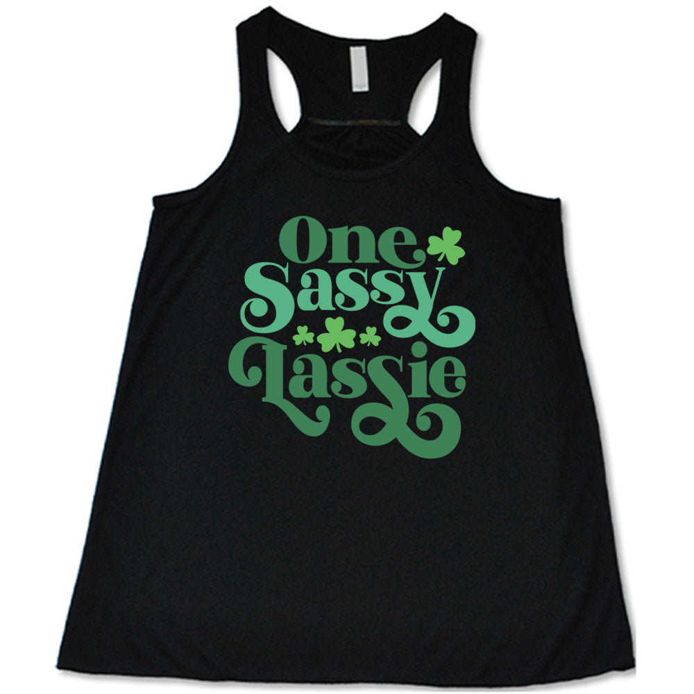 black flowy tank with the words "one sassy lassie" on it, with a few shamrock graphics
