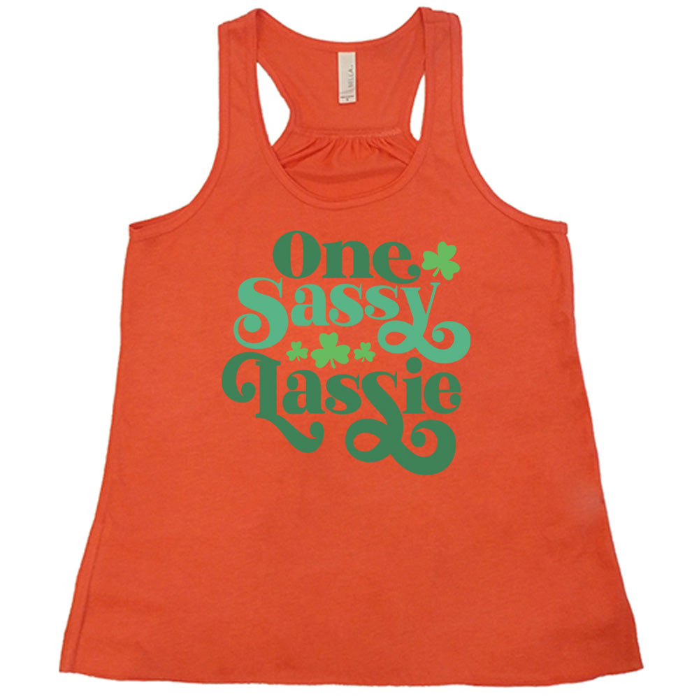 coral flowy tank with the words "one sassy lassie" on it, with a few shamrock graphics