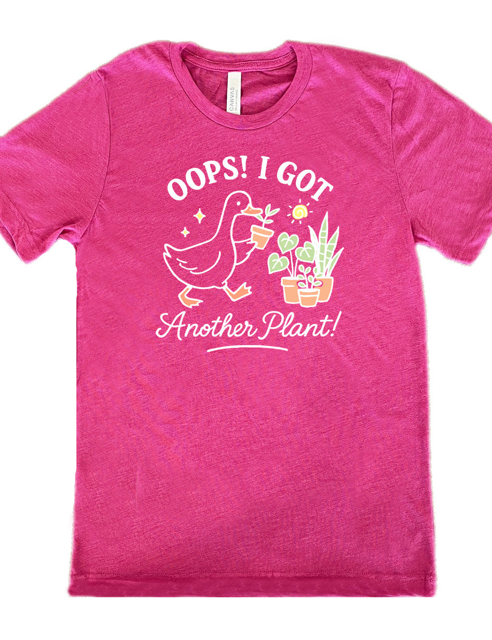 berry unisex tee with the graphic of a goose holding a little plant, walking toward a few other plants, and the words surrounding it saying "Oops! I got  another plant!"