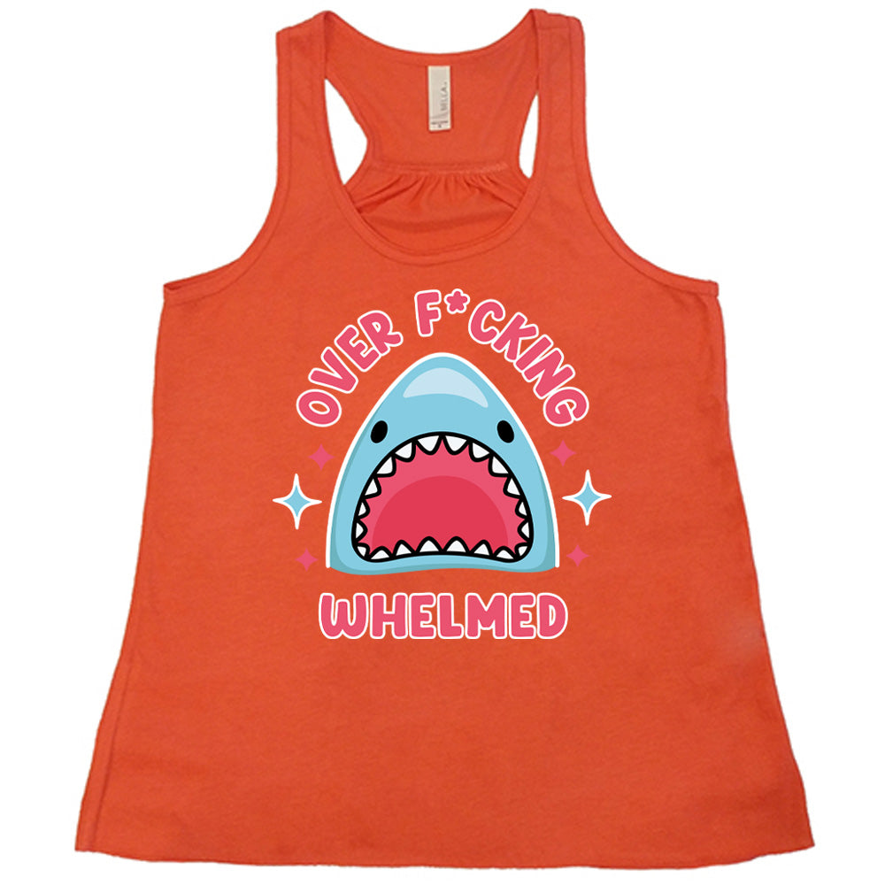 coral racerback flowy tank with the graphic of a shark's head with mouth wide open, and the words around the graphic saying "over f*cking whelmed" and a few stars on the sides