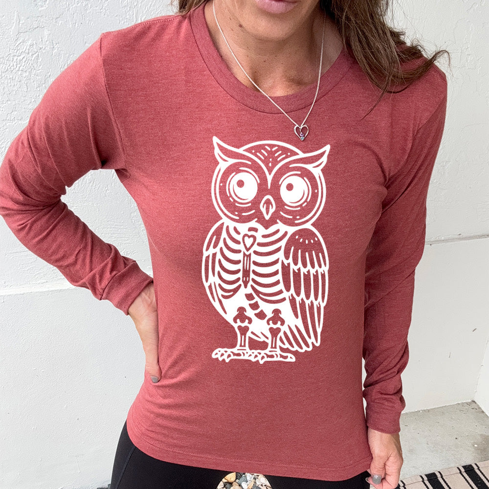 heather clay long sleeve tee with the large graphic of an owl with part of its body in skeletal form, with a little heart in the middle of its ribcage
