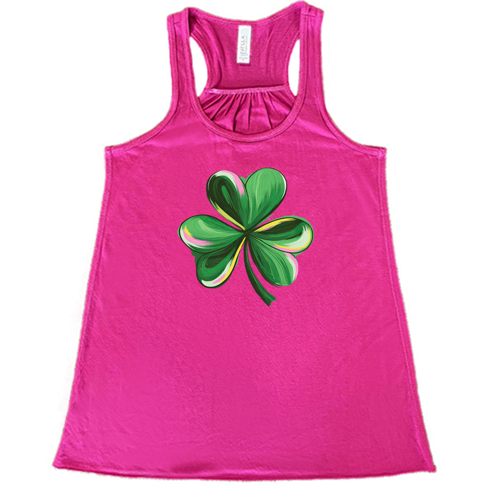 berry shirt with a painted shamrock graphic on it