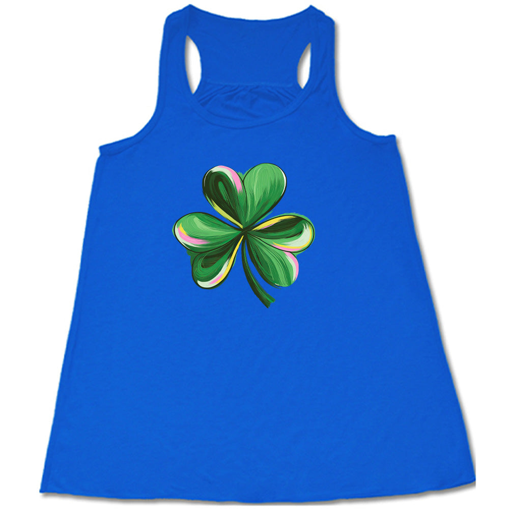 blue shirt with a painted shamrock graphic on it