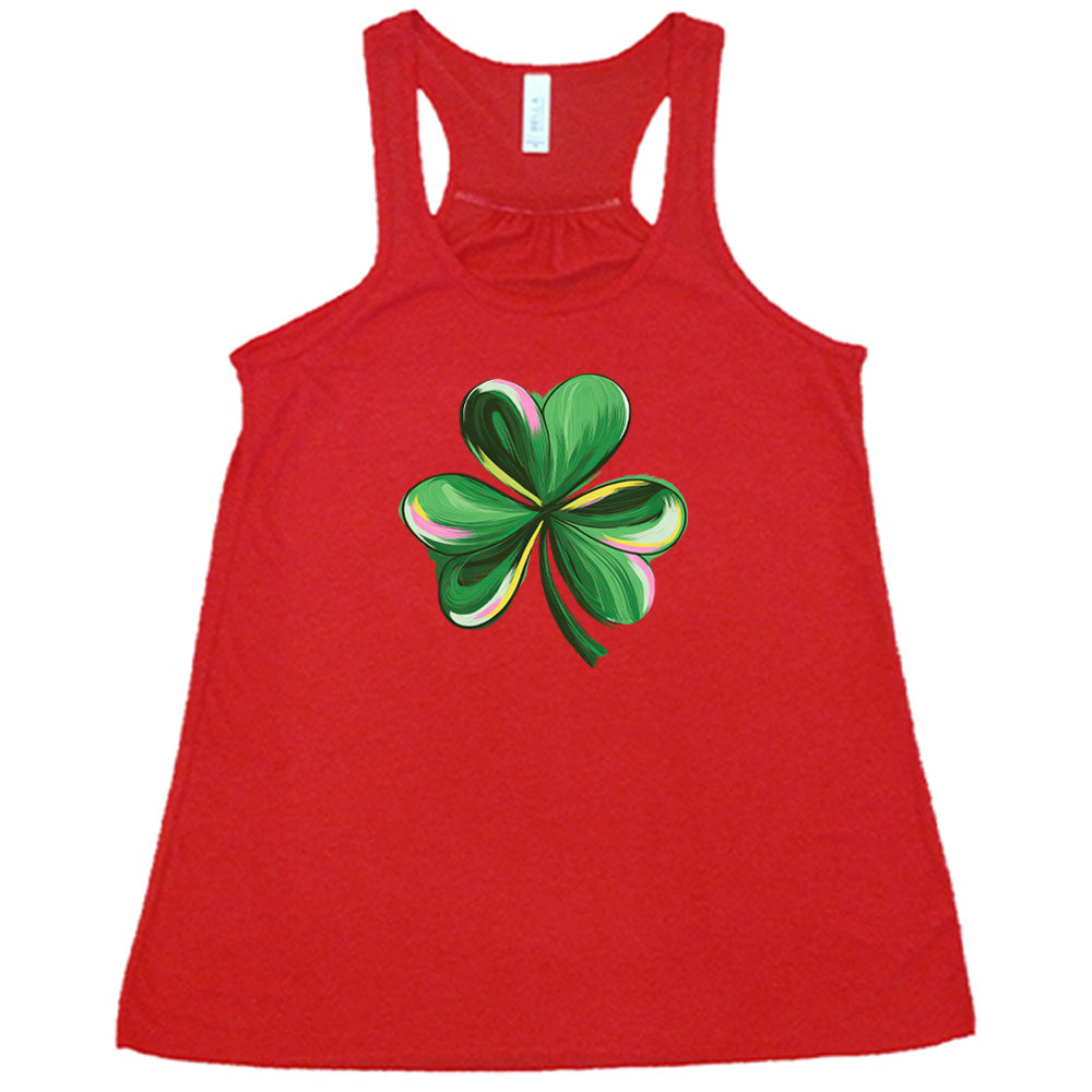 red shirt with a painted shamrock graphic on it