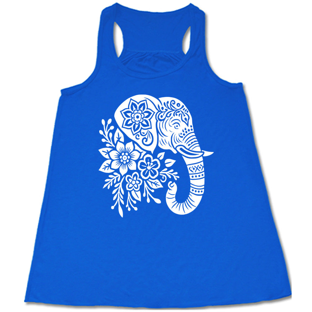 blue racerback tank with the large graphic of the profile of an elephant's head, with flowers for a torso, and patterns lining its truck and flowers patterned into its ear and forehead