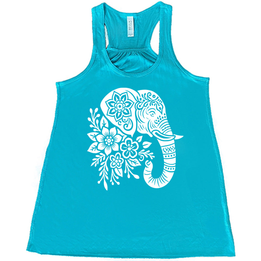 teal racerback tank with the large graphic of the profile of an elephant's head, with flowers for a torso, and patterns lining its truck and flowers patterned into its ear and forehead