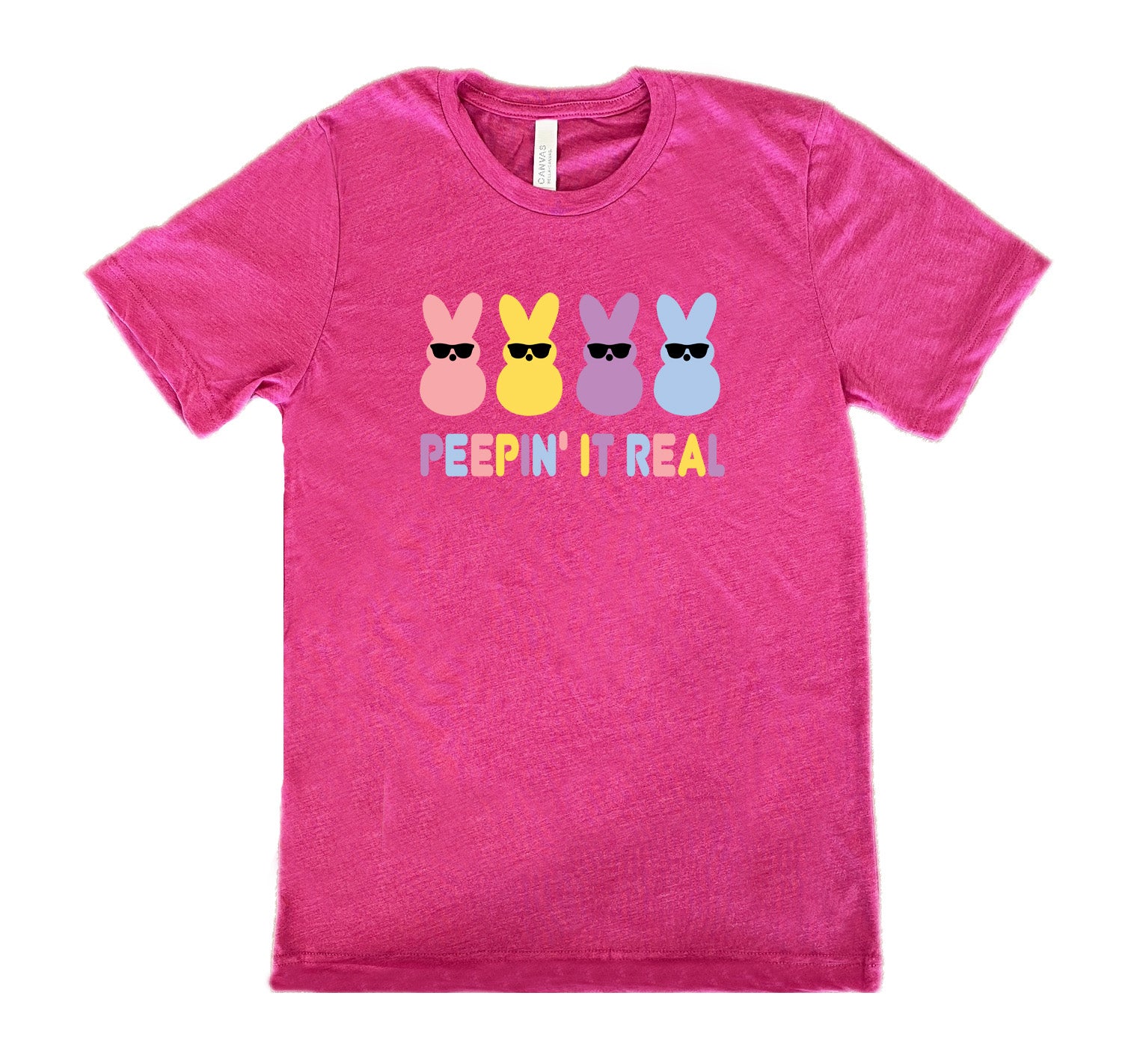 Berry colored shirt with an Easter-colored bunnies graphic on it that says "Peepin it Real" 