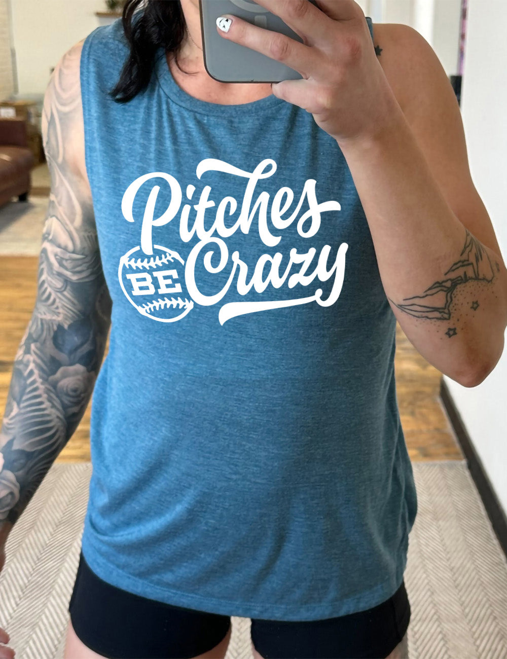 deep teal muscle tank with the words "pitches be crazy" on it, with the word "be" inside of a baseball outline graphic