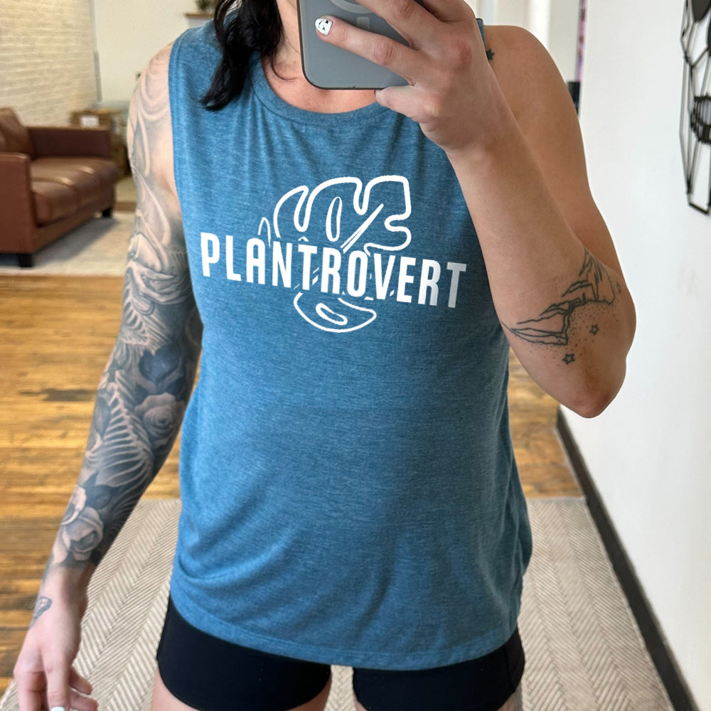 deep teal muscle tank with a leaf graphic on it that says "Plantrovert" 