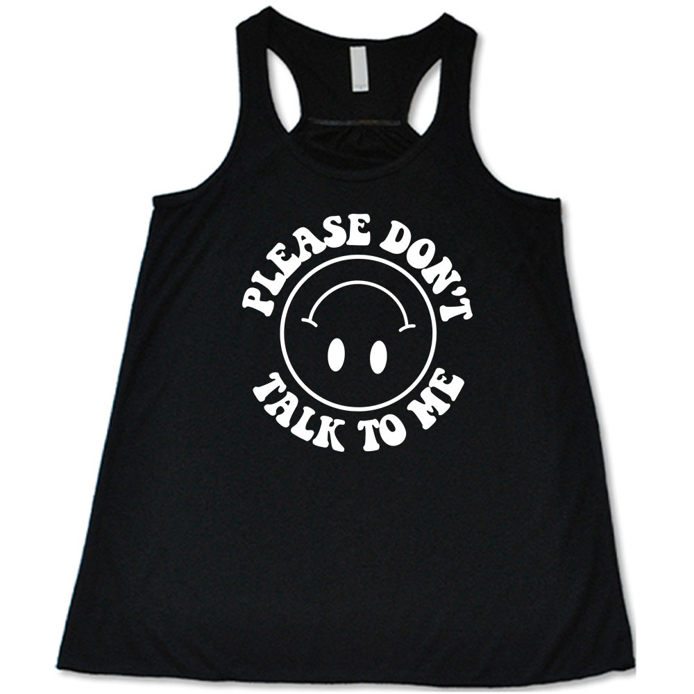 black flowy tank with the words "please don't talk to me" creating mirrored arcs around the outlined circle graphic of an upside-down happy face