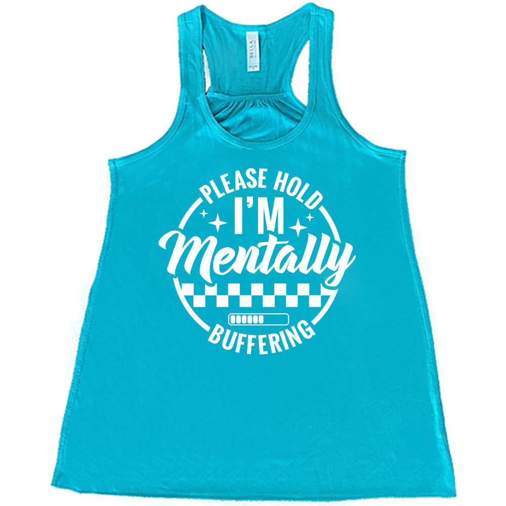 teal racerback flowy tank with the words "please hold I'm mentally buffering" written on it in a circle graphic, with some of the words part of the arches, and within the circle there are two layers of checkerboard as well as a buffering bar, which is about 6 out of 10 full