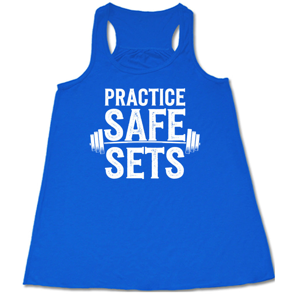blue flowy tanks with the words "practice safe sets" on it, with the image of a barbell
