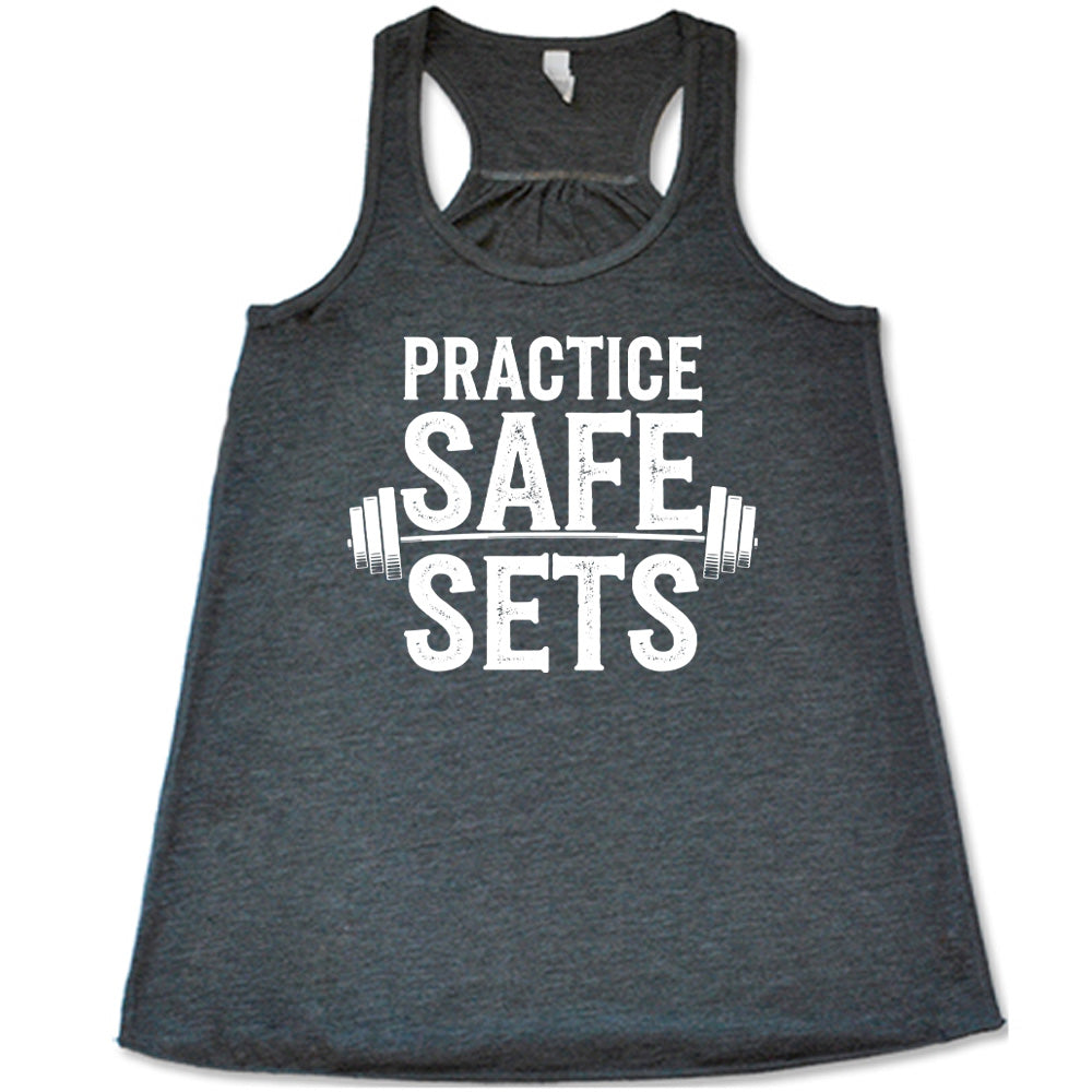 grey flowy tanks with the words "practice safe sets" on it, with the image of a barbell