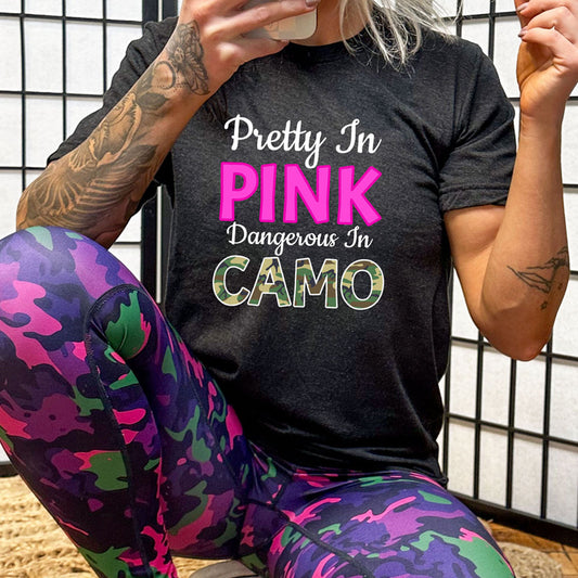 model wearing the black "Pretty In Pink Dangerous In Camo" Unisex Shirt