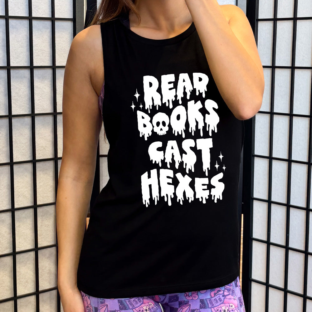 black muscle tank with the text "Read Books Cast Hexes" on it