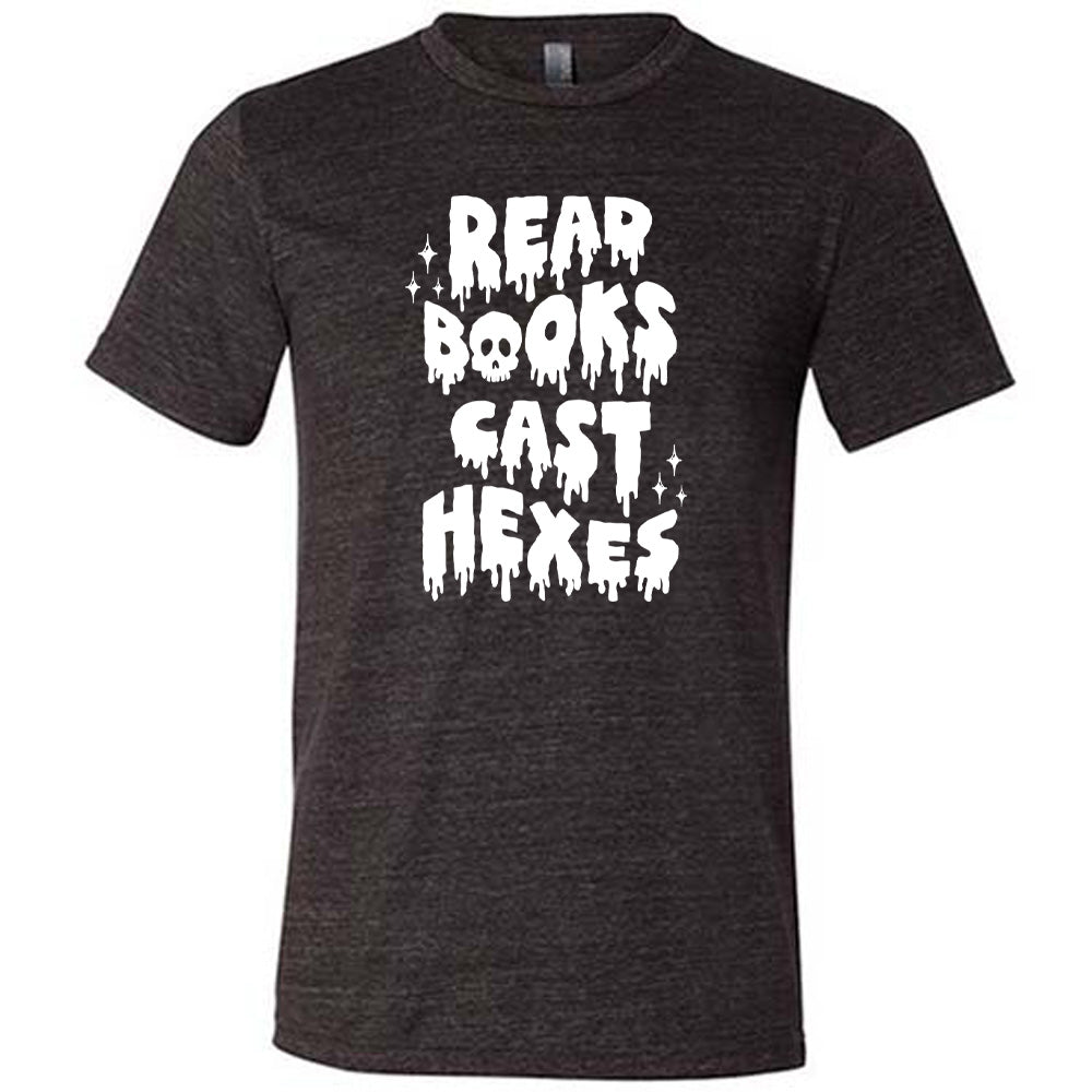 black shirt with the text "Read Books Cast Hexes" on it