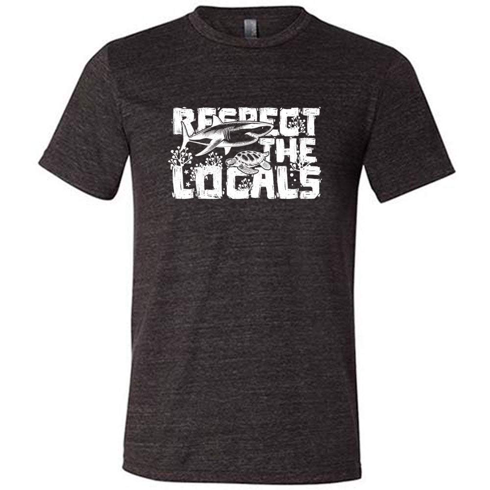 Black colored shirt with a shark and turtle graphic on it that says "Respect The Locals" 
