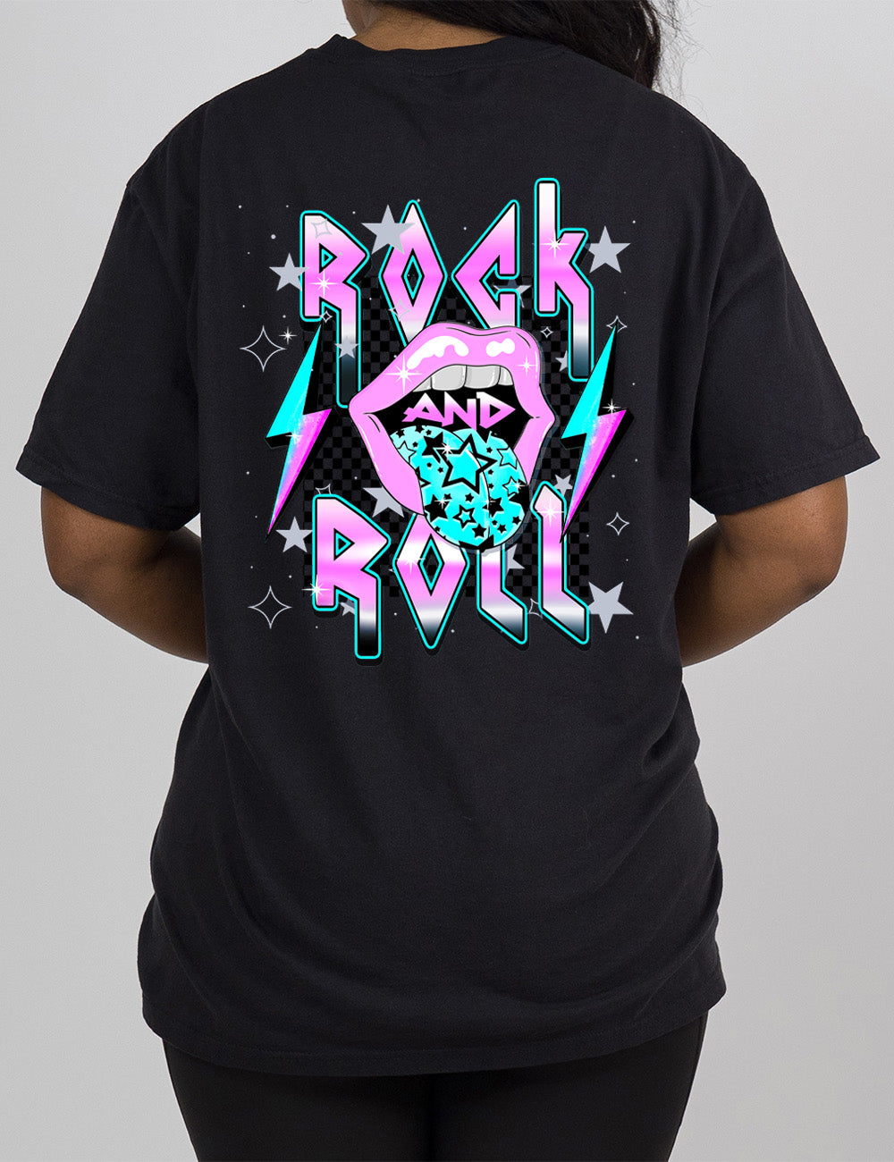 black modern tee with print placement on the back, with the words "rock and roll" on it, with the word "and" within the large graphic of a mouth, with it's tongue sticking out with stars on it, and a number of stars around the words, with a lightning bolt on both sides of the mouth 
