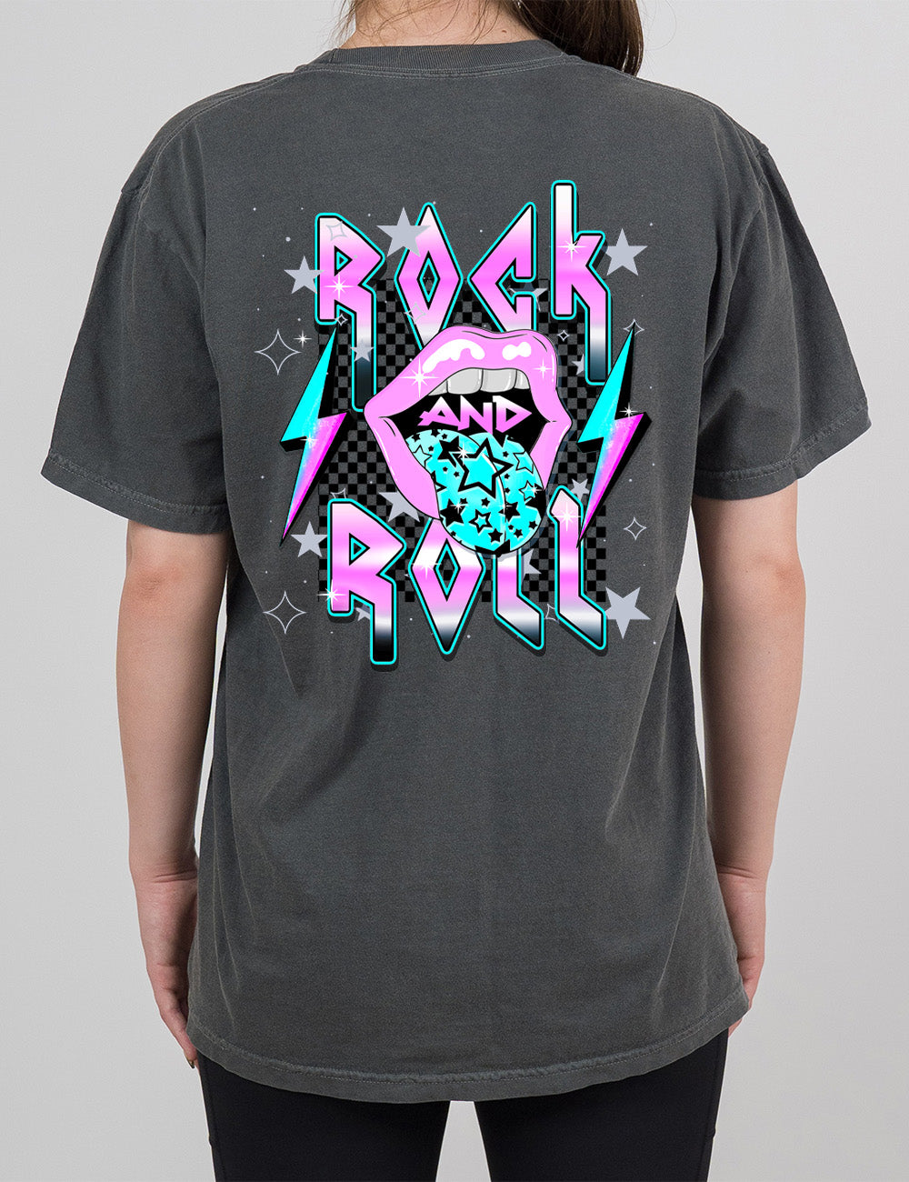 pepper modern tee with print placement on the back, with the words "rock and roll" on it, with the word "and" within the large graphic of a mouth, with it's tongue sticking out with stars on it, and a number of stars around the words, with a lightning bolt on both sides of the mouth 