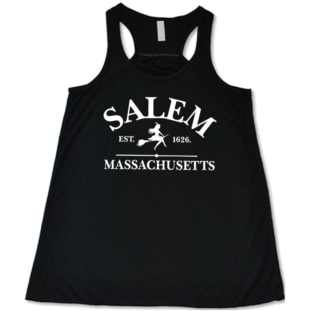 Black colored flowy tank with witch on a broom graphic on it that says "Salem EST. 1626 Massachusetts"