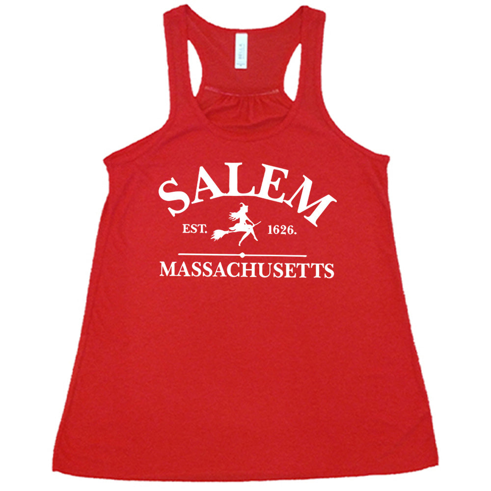 Red colored flowy tank with witch on a broom graphic on it that says "Salem EST. 1626 Massachusetts"