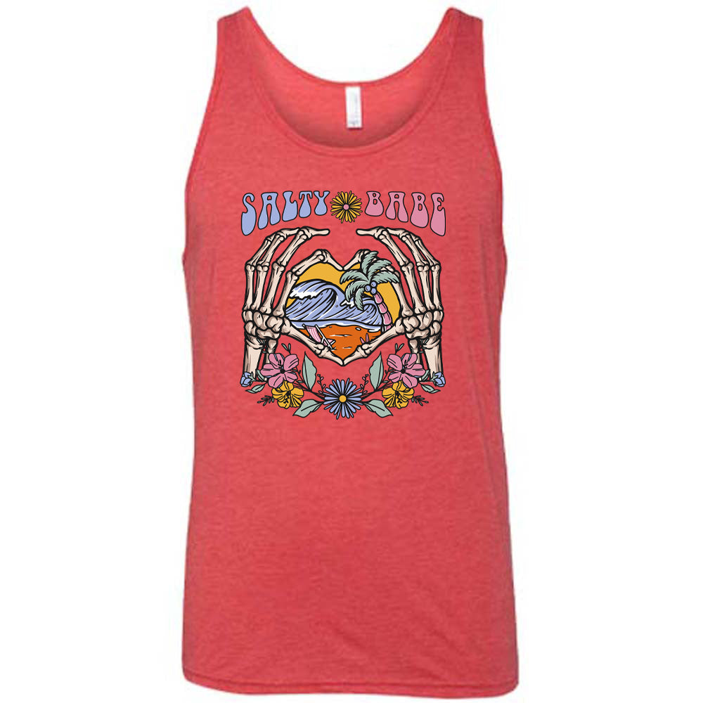 Red colored tank with a skeleton heart hands around ocean waves graphic on it that says "Salty Babe" 
