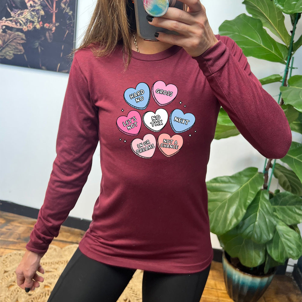 maroon long sleeve shirt with cartoon valentine heart candy graphics on it