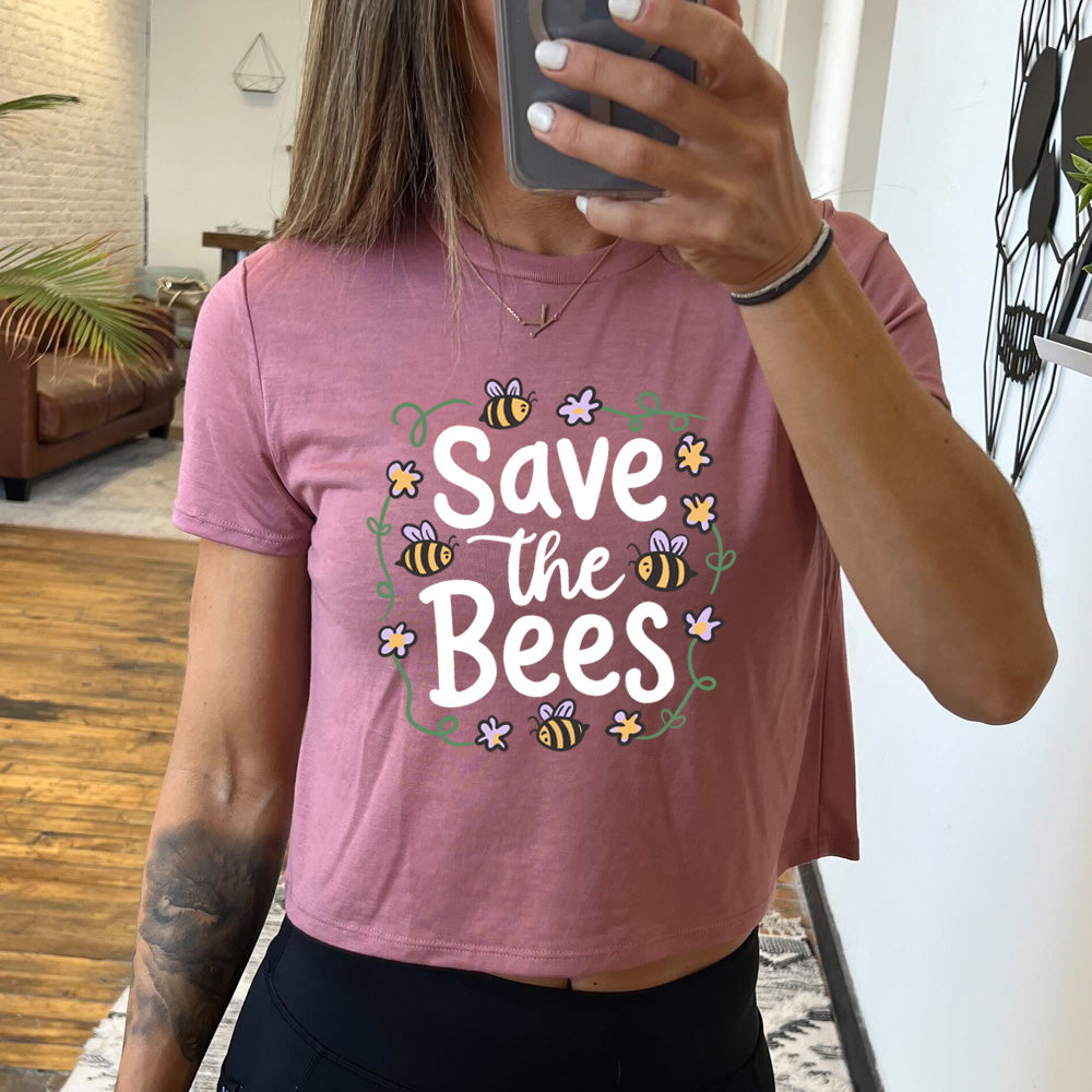 mauve cropped tee with a bees and flowers graphic on it that says "Save The Bees" 