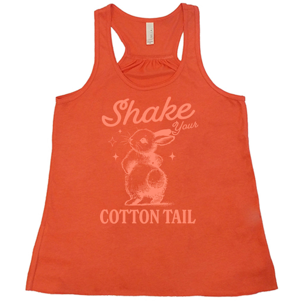 coral racerback tank with the words "shake your cotton tail" on it, with the large graphic of a rabbit, mid-shake of its behind, looking over its shoulder