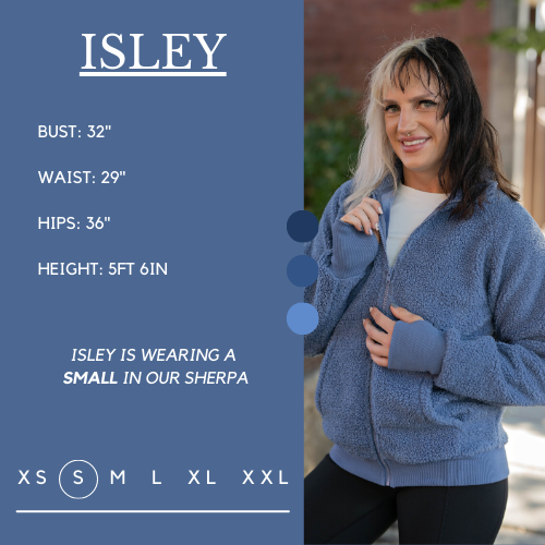 Model's measurements of 32 inch bust, 29 inch waist, 36 inch hips, and height of 5 foot 6 inches. She is wearing a size small in the sherpa