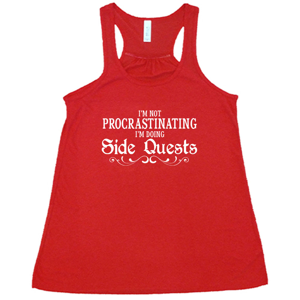 red shirt with the text "I'm Not Procrastinating I'm Doing Side Quests" on it