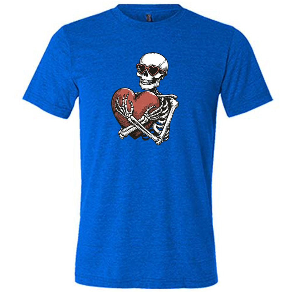 blue shirt with a skeleton hugging a heart graphic on it