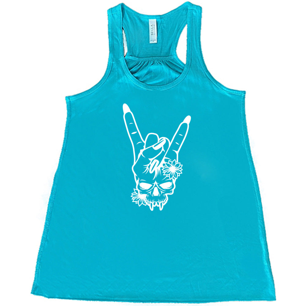 teal shirt with the "Skull Rocker Hand" graphic on it